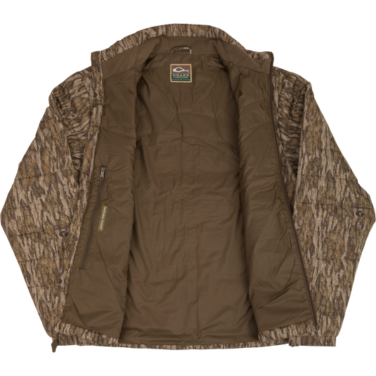 MST Synthetic Down Pack Jacket with horizontal baffle design, zippered pockets, and reinforced elbow patches. Lightweight, packable, and adjustable waist for versatile use.