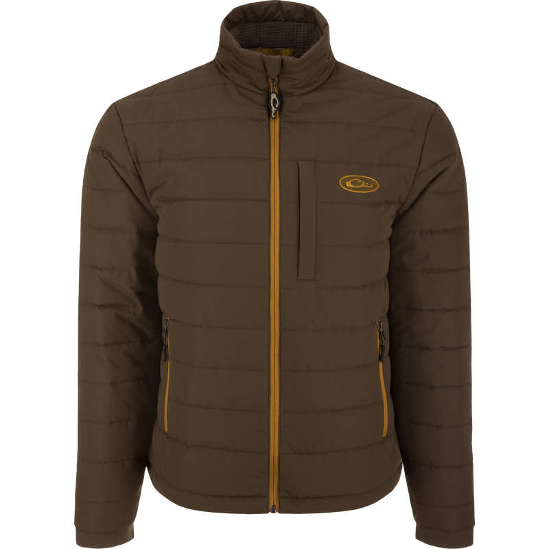 Close-up of the MST Synthetic Down Pack Jacket's zipper and baffle design, highlighting its lightweight, packable features ideal for versatile, outdoor hunting use.