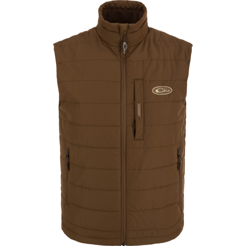 MST Synthetic Down Pack Vest with white logo, featuring horizontal baffle design and zippered chest pocket, ideal for layering and versatile outdoor use.