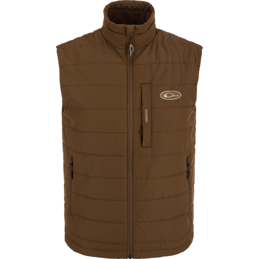 MST Synthetic Down Pack Vest with white logo, featuring horizontal baffle design and zippered chest pocket, ideal for layering and versatile outdoor use.