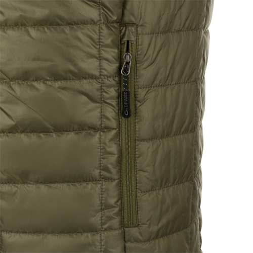 A close-up of the Synthetic Down Pac-Vest jacket's zipper, made of 100% polyester shell with a DWR water-repellent finish.