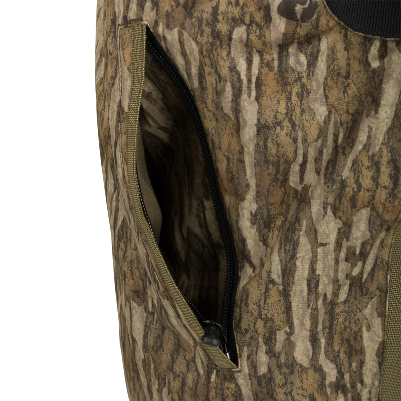 LST Reflex Insulated Bib: Close-up of a durable, waterproof pocket with zipper and fabric details.