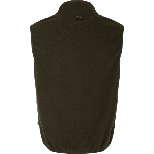 A close-up of the Camp Fleece Vest, a lightweight and breathable layering piece for Spring or Fall outfits. Made of 100% polyester micro-fleece with moisture-wicking properties. Features include anti-pill treatment, vertical Magnattach™ pocket, and lower zippered hand warmer pockets. Perfect for camping or pairing with Drake outerwear.