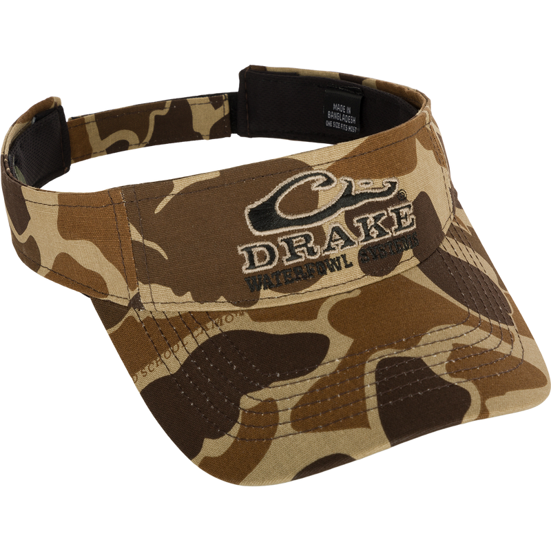 Drake Logo Visor with camouflage pattern and embroidered Purewhitelaneshop Systems logo on the front. Velcro back closure. Made of 100% cotton (solid colors) and 100% polyester (camo colors). Lightly structured front panels. One size fits most.