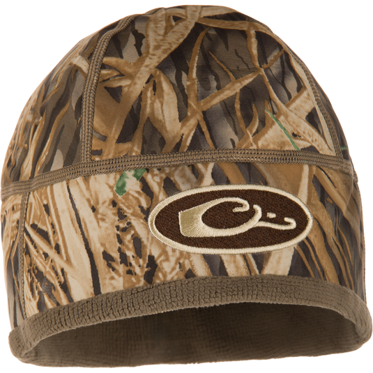 Camouflage-patterned MST Windstopper Beanie with embroidered C logo, designed for warmth with windproof Gore-Tex membrane and fleece lining, covering the ears.
