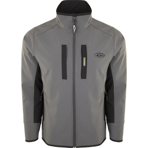 A Windproof Tech Jacket with a stylish two-tone design, perfect for cool Fall days and nights. Features include vertical and chest pockets with zipper closures, side stretch panels, and a drawstring waist. Made with a windproof laminate and check fleece backing.