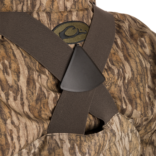 Close-up of the Women’s Insulated Guardian Elite Vanguard Breathable Waders, showing camouflage pattern, reinforced seams, and front cargo pouch.