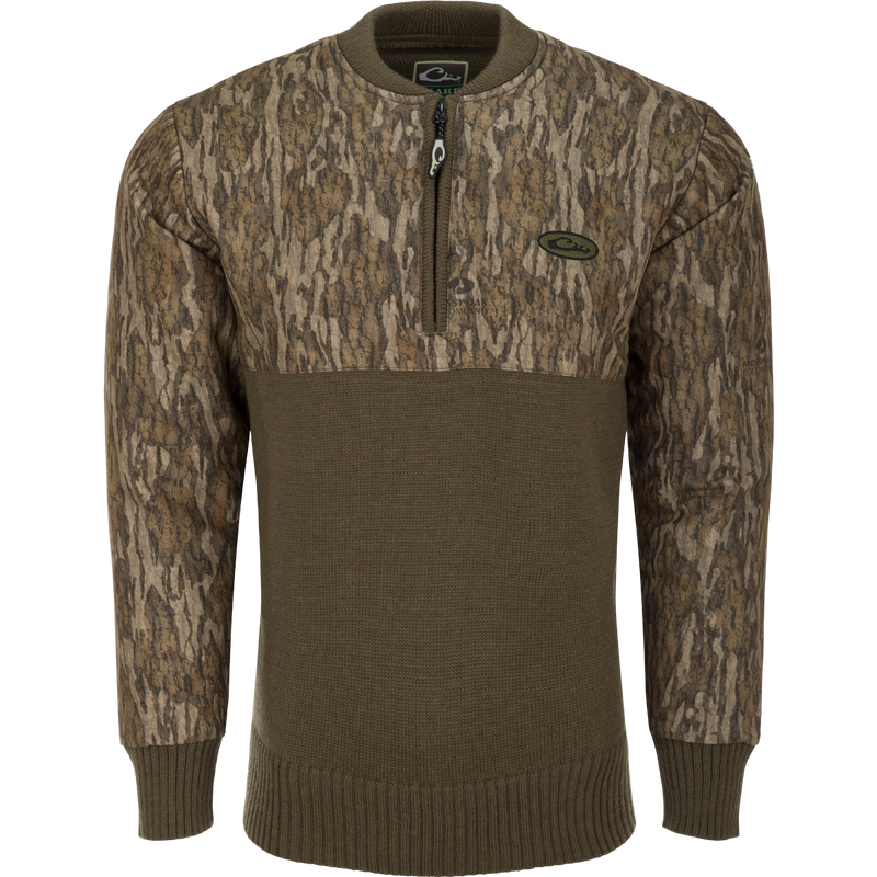 A close-up of the Camo 1/4 Zip Wool Sweater, featuring a knitted wool lower and a polyester upper treated with DWR for weather protection. The sweater has a quarter zip for ventilation and comfort.