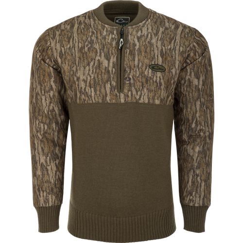 A close-up of the Camo 1/4 Zip Wool Sweater, featuring a knitted wool lower and a polyester upper treated with DWR for weather protection. The sweater has a quarter zip for ventilation and comfort.