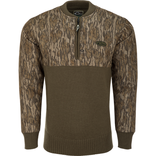 A close-up of the Camo 1/4 Zip Wool Sweater, featuring a knitted wool lower and a polyester upper treated with DWR for weather protection. The sweater has a quarter zip for ventilation and comfort.