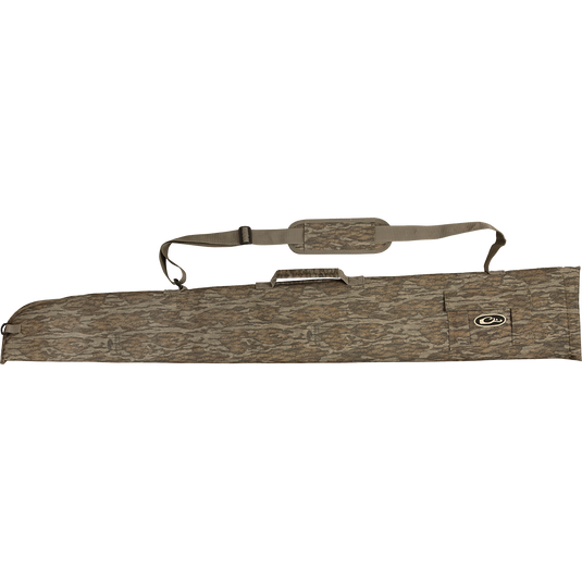 A side-opening gun case with a brown bag and strap, featuring a camouflage pocket and an outer accessory pocket for choke tubes.
