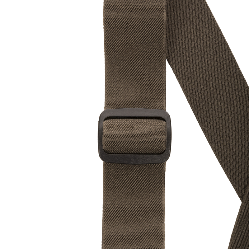 Close-up of the MST Waist-High Insulated Bibs' belt buckle, showcasing heavy-duty elastic suspenders and adjustable Velcro waist for a secure, customized fit.
