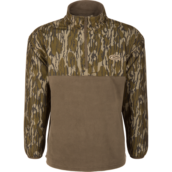MST Quarter Zip Refuge Eqwader Jacket on a mannequin, featuring a camouflage upper, solid fleece lower, stand-up collar, and small chest logo, ideal for waterfowl hunting.