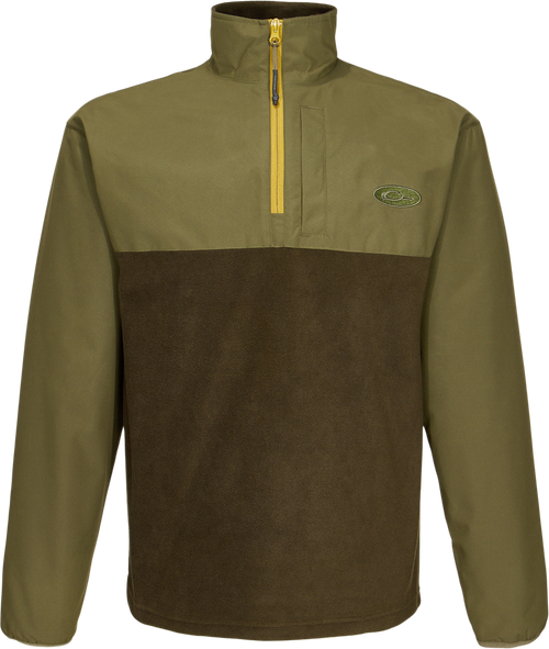 Close-up of the MST Quarter Zip Refuge Eqwader Jacket's zipper and logo, highlighting its innovative waterproof and breathable fabric design for enhanced hunting comfort.