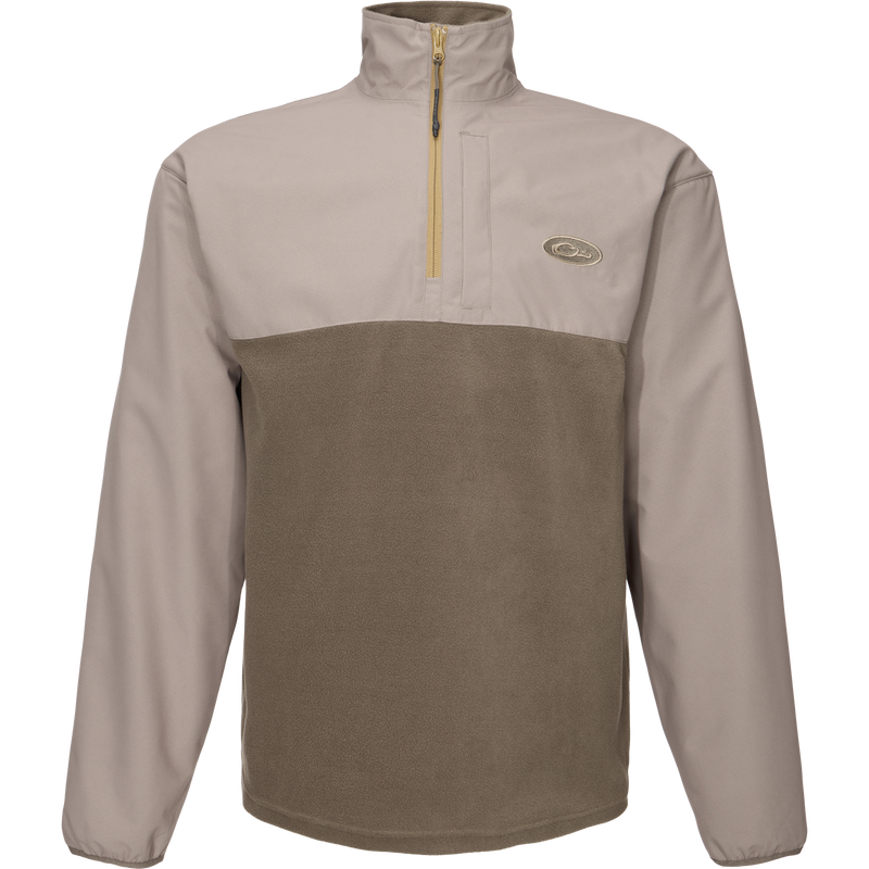 Close-up of the MST Quarter Zip Refuge Eqwader Jacket's zipper, highlighting its innovative waterproof Refuge HS™ fabric and breathable design for enhanced hunting comfort.