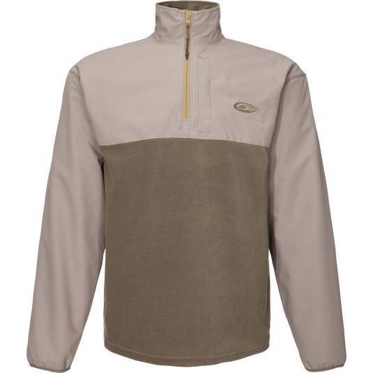 Close-up of the MST Quarter Zip Refuge Eqwader Jacket's zipper, highlighting its innovative waterproof Refuge HS™ fabric and breathable design for enhanced hunting comfort.