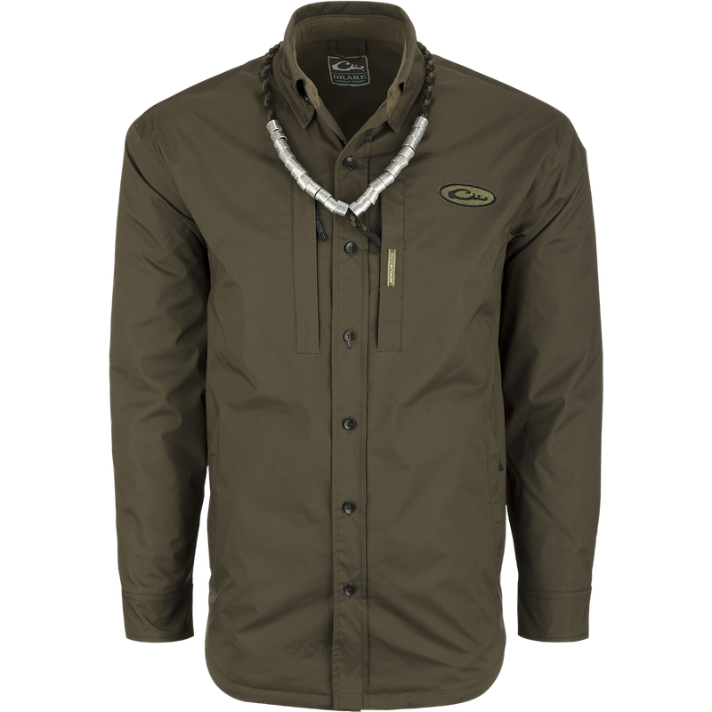 A green shirt with a necklace, ideal for fluctuating weather conditions. Provides comfort like a shirt and waterproofing like a jacket. Plenty of pocket storage for essentials. MST Fleece-Lined Guardian Flex Jac-Shirt.