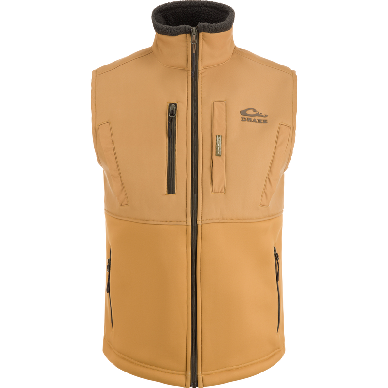 MST Hole Shot Two-Tone Eqwader Vest with windproof upper, sherpa-lined lower, high handwarmer pockets, and adjustable waist, ideal for mid-to-late season hunting.