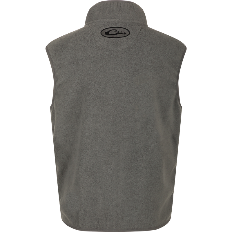A grey Youth Camp Fleece Vest with logo, anti-pill treatment, moisture-wicking properties, Magnattach pocket, and zippered handwarmer pockets.
