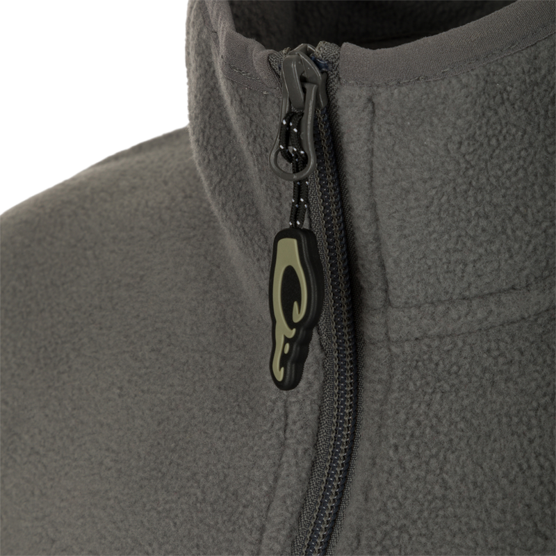 A close-up of the zipper on the Youth Camp Fleece Vest, showcasing its durability and functionality.