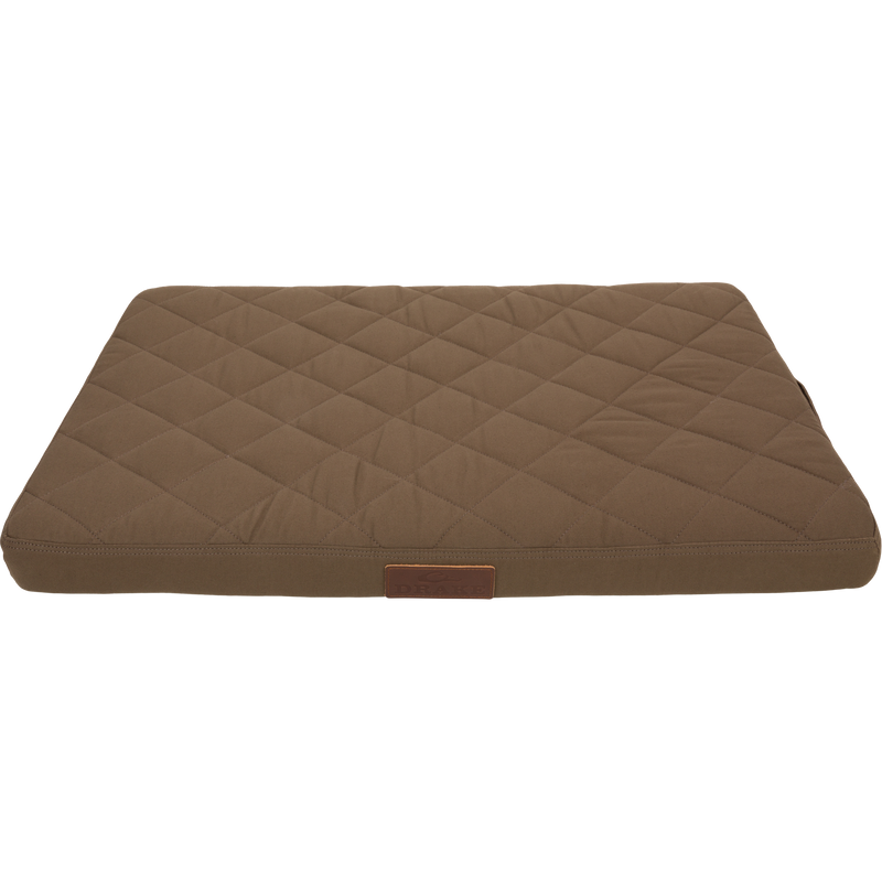 Team Gun Dog Landing Zone Quilted Canvas Dog Bed, featuring a diamond-stitched brown surface with a small DRAKE label, ideal for outdoor-loving pets.