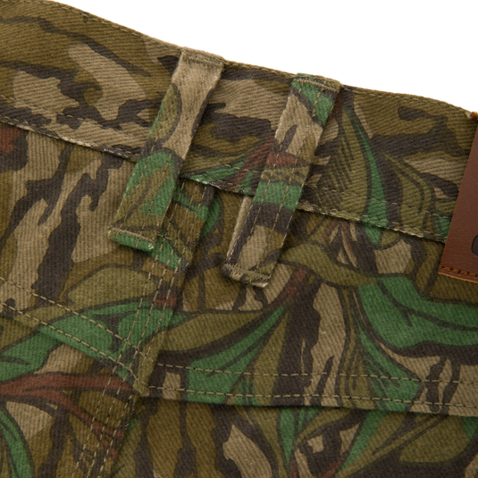 Throwback 80 Field Pant, featuring durable 9.4oz cotton twill, triple stitching, reinforced knees, and antique brass riveted pockets, designed for rugged outdoor activities.