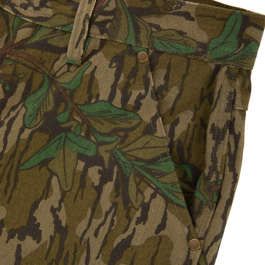 Throwback 80 Field Pant close-up, showcasing durable camouflage fabric, reinforced knees, and brass riveted pockets, ideal for rugged outdoor use.