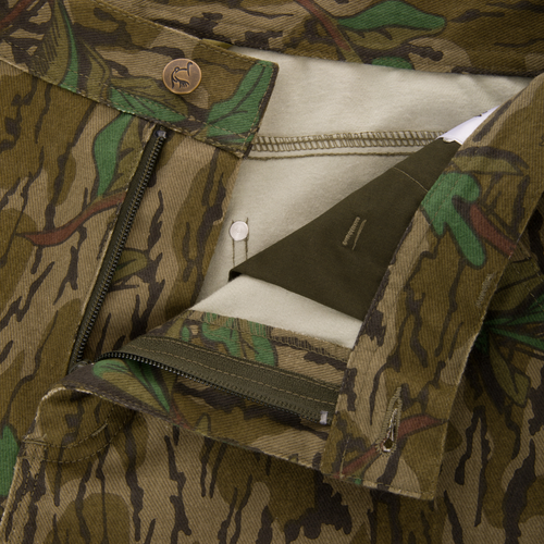 Throwback 80 Field Pant with camouflage pattern, featuring durable triple stitching, reinforced knees, antique brass riveted pockets, and YKK zippered fly with bird-designed button.