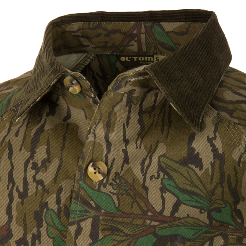 Close-up of the Throwback 80 Field Shirt Jacket featuring a large button, triple-needle stitching, and antique brass riveted pocket for durability and style.