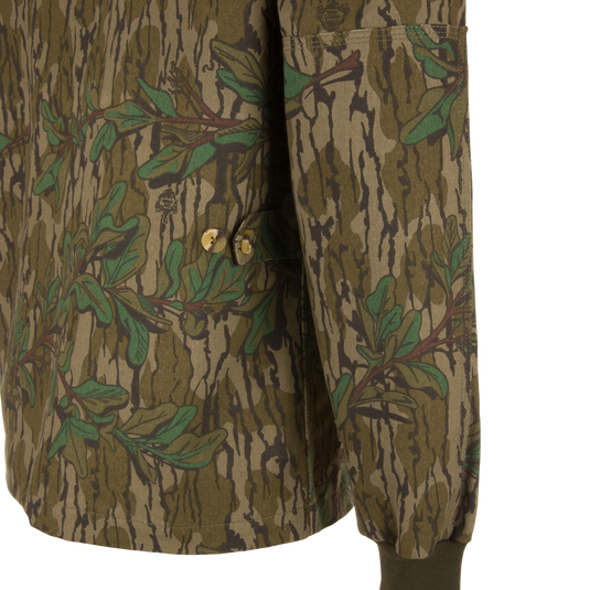 Close-up of the Throwback 80 Field Shirt Jacket, highlighting its durable cotton twill fabric, triple-needle stitching, and antique brass riveted pockets.