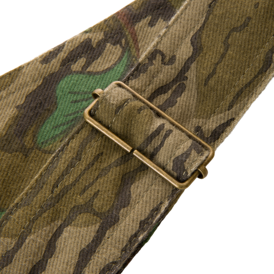 Close-up of Throwback 80 Field Bib showing durable cotton twill material and antique brass riveted pockets, designed for tough outdoor tasks.