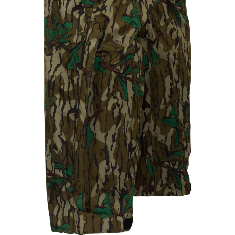Closeup of rain pants perfect for outdoor activities. Waterproof and windproof, these pants are easily packable and fit over your outerwear. Ideal for spring showers during turkey season. From Purewhitelaneshop, your go-to for high-quality hunting gear and clothing.
