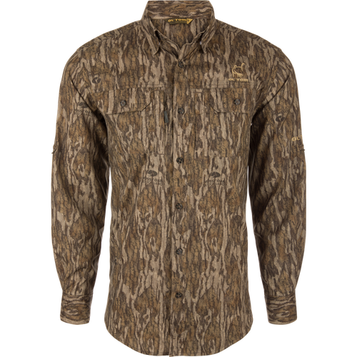 Men's Camo Wingshooter Trey Shirt with tree pattern, long sleeves, hidden button-down collar, vented back, and two chest pockets for hunting.
