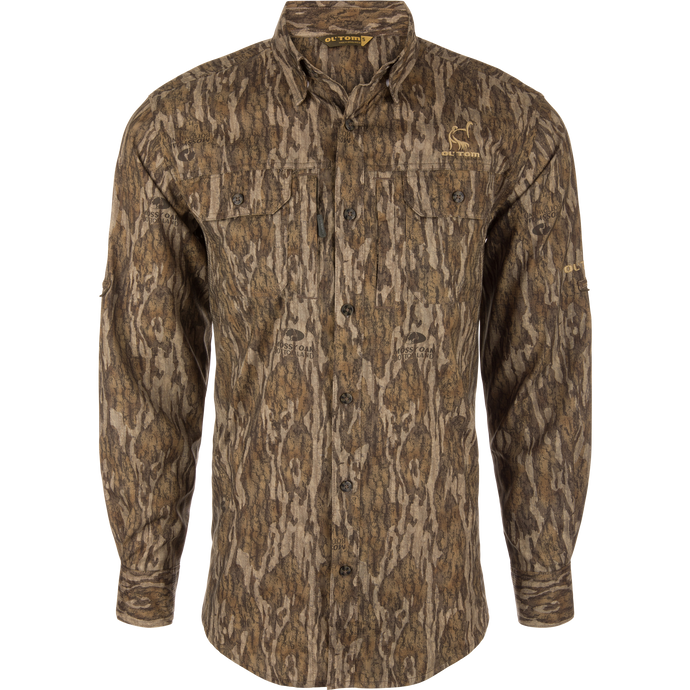 Men's Camo Wingshooter Trey Shirt with tree pattern, long sleeves, hidden button-down collar, vented back, and two chest pockets for hunting.