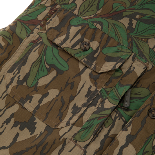 Men's Camo Wingshooter Trey Shirt, featuring camouflage pattern, close-up of button, pockets, and vented back, highlighting technical features and classic design.