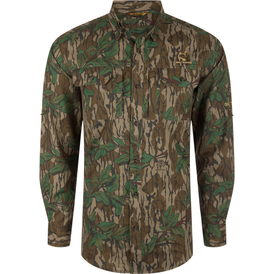 Men's Camo Wingshooter Trey Shirt with camouflage pattern, showcasing long sleeves, hidden button-down collar, chest pockets, and vented cape back for enhanced performance and comfort.
