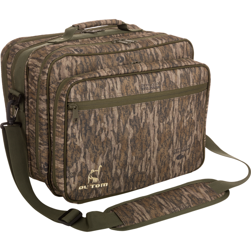 Ol' Tom Treasure Chest hunting bag with adjustable strap, featuring multiple compartments for organizing turkey calls and tools, shown with close-up of durable material and zippers.