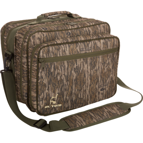 Ol' Tom Treasure Chest hunting bag with adjustable strap, featuring multiple compartments for organizing turkey calls and tools, shown with close-up of durable material and zippers.