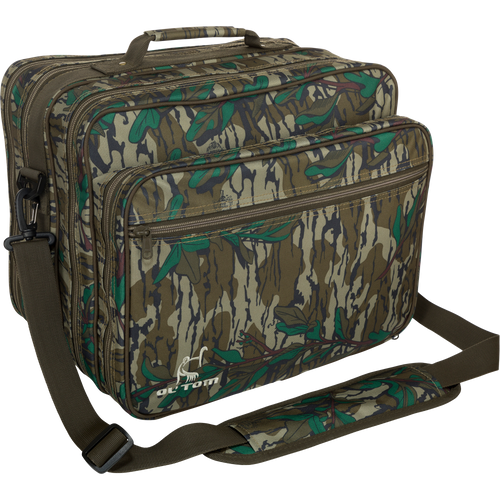 Ol' Tom Treasure Chest, a camouflage hunting bag with a strap, features multiple compartments for organizing turkey season gear and tools.