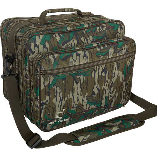 Ol' Tom Treasure Chest, a camouflage hunting bag with a strap, features multiple compartments for organizing turkey season gear and tools.