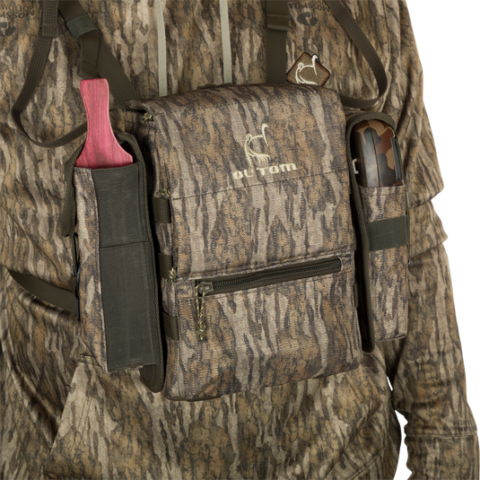 Turkey Chest Pack with camouflage design, featuring multiple compartments, detachable bino harness, and accessories, perfect for hunting trips.
