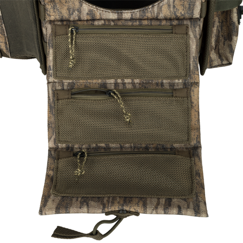 Turkey Chest Pack with multiple zippered pockets, detachable bino harness, and stowable rain fly, designed for lightweight hunting trips and gear organization.