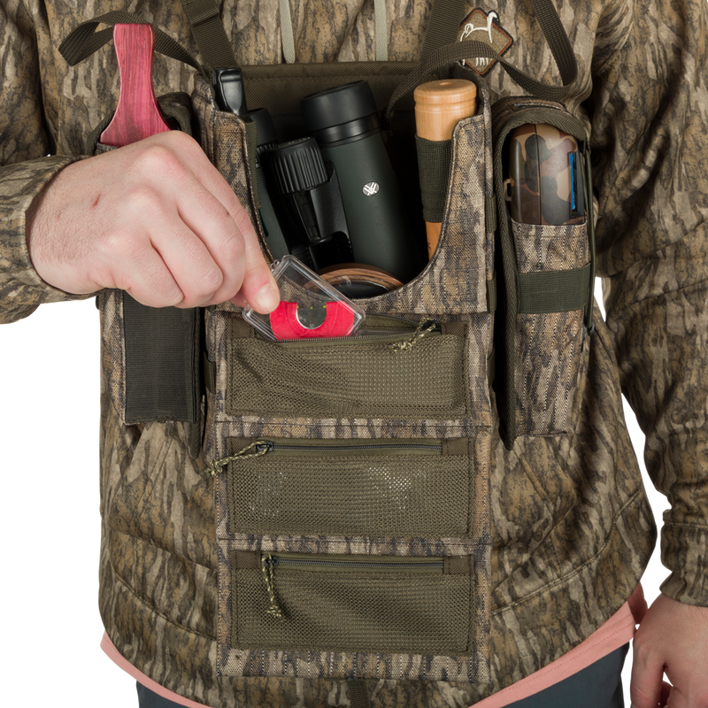 Turkey Chest Pack with camouflage vest, showcasing multiple pockets and detachable bino harness, ideal for hunting trips.