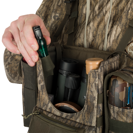 Turkey Chest Pack with detachable bino harness, multiple pockets, and stowable rain fly, perfect for hunting trips.