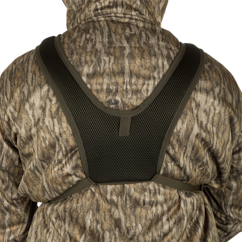 Turkey Chest Pack with camouflage design, featuring multiple pockets, removable bino harness, and stowable rain fly, ideal for hunting adventures.