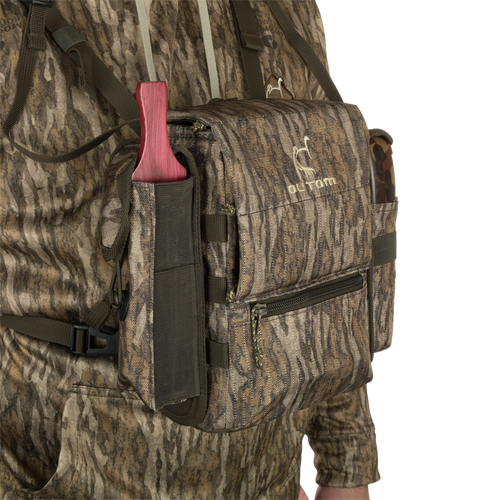 Turkey Chest Pack in camouflage, featuring multiple pockets, detachable bino harness, and a stowable rain fly, ideal for hunting trips.
