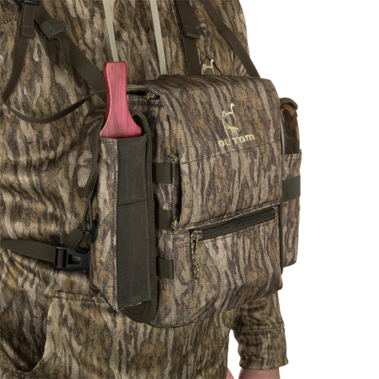 Turkey Chest Pack in camouflage, featuring multiple pockets, detachable bino harness, and a stowable rain fly, ideal for hunting trips.