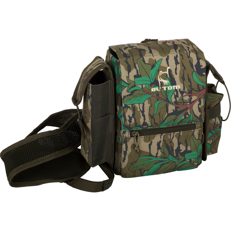 Turkey Chest Pack featuring a camouflage design, adjustable straps, and multiple compartments, ideal for hunting trips with integrated bino harness and rain protection.