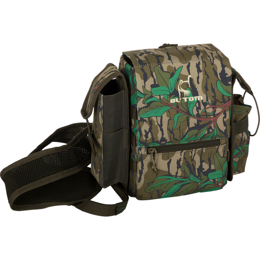 Turkey Chest Pack featuring a camouflage design, adjustable straps, and multiple compartments, ideal for hunting trips with integrated bino harness and rain protection.