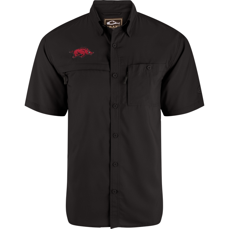 Arkansas 8-Shot Short Sleeve Shirt featuring a black button-up design with a red razorback hog graphic, vented cape back, and dual chest pockets with hidden zippers.